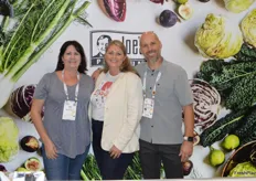 Pam Wooten (Eden South), Jenny McAfee with J. Marchini Farms and Bryan Thornton with Coosemans Atlanta are catching up in the booth of J. Marchini Farms.